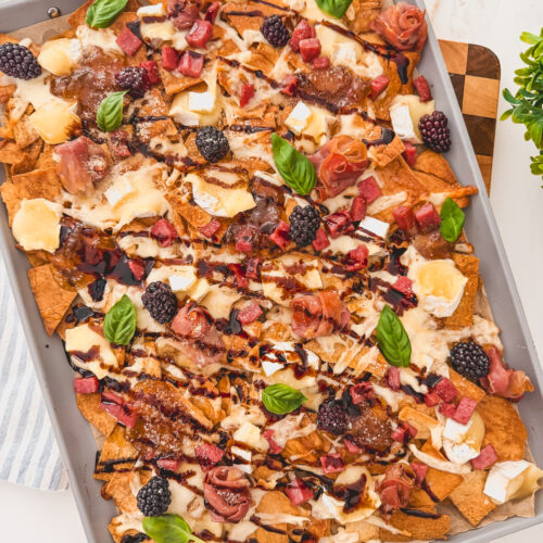 Charcuterie chips made with pita chips, brie, and blackberries