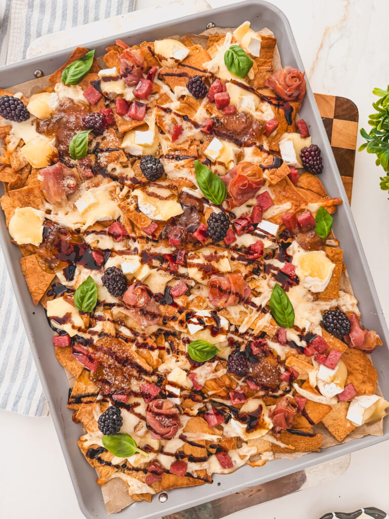 Charcuterie chips made with pita chips, brie, and blackberries