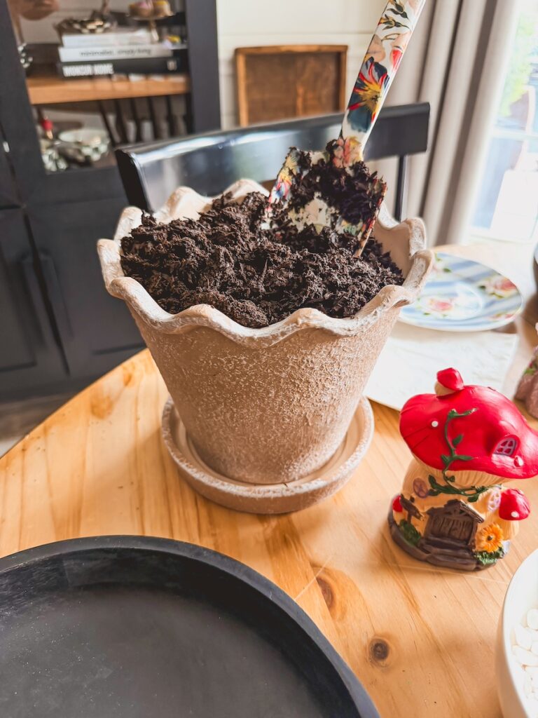potting soil in planter for fairy garden set up 