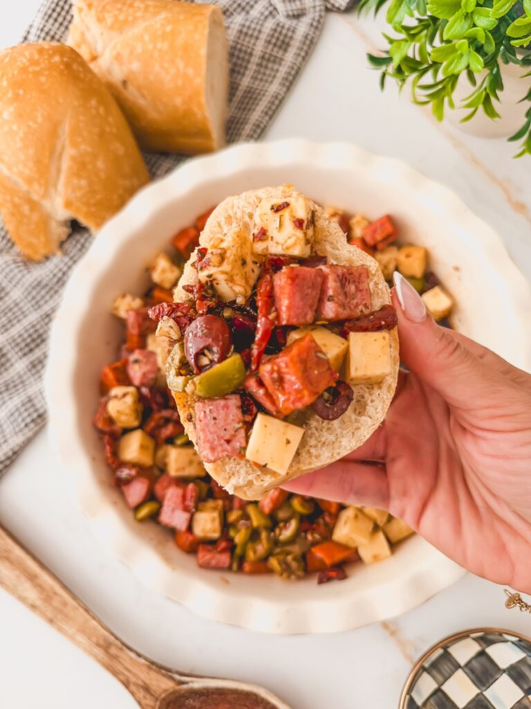scoop of charcuterie dip on bread