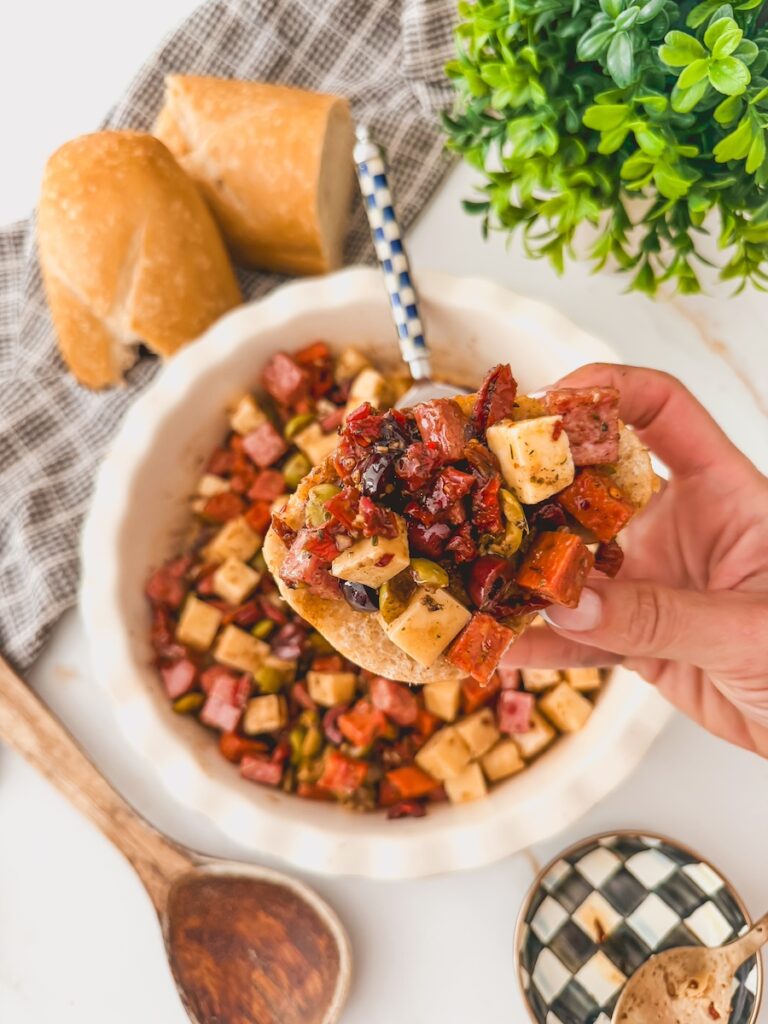 charcuterie dip on a slice of fresh baked bread