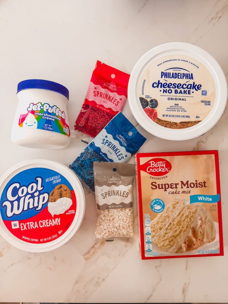 flatlay of ingredients for funfetti dip - marshamllow fluff, philadelphia no bake cream cheese, white cake mix , cool whip
