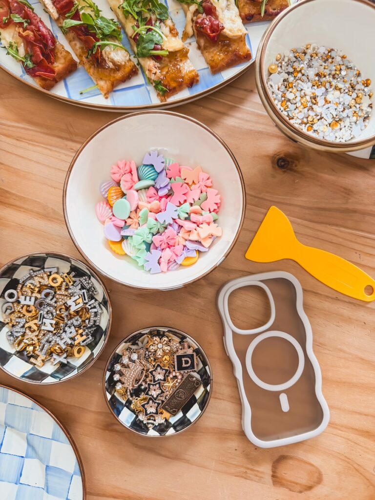flatlay of phone case and resin charms for craft night