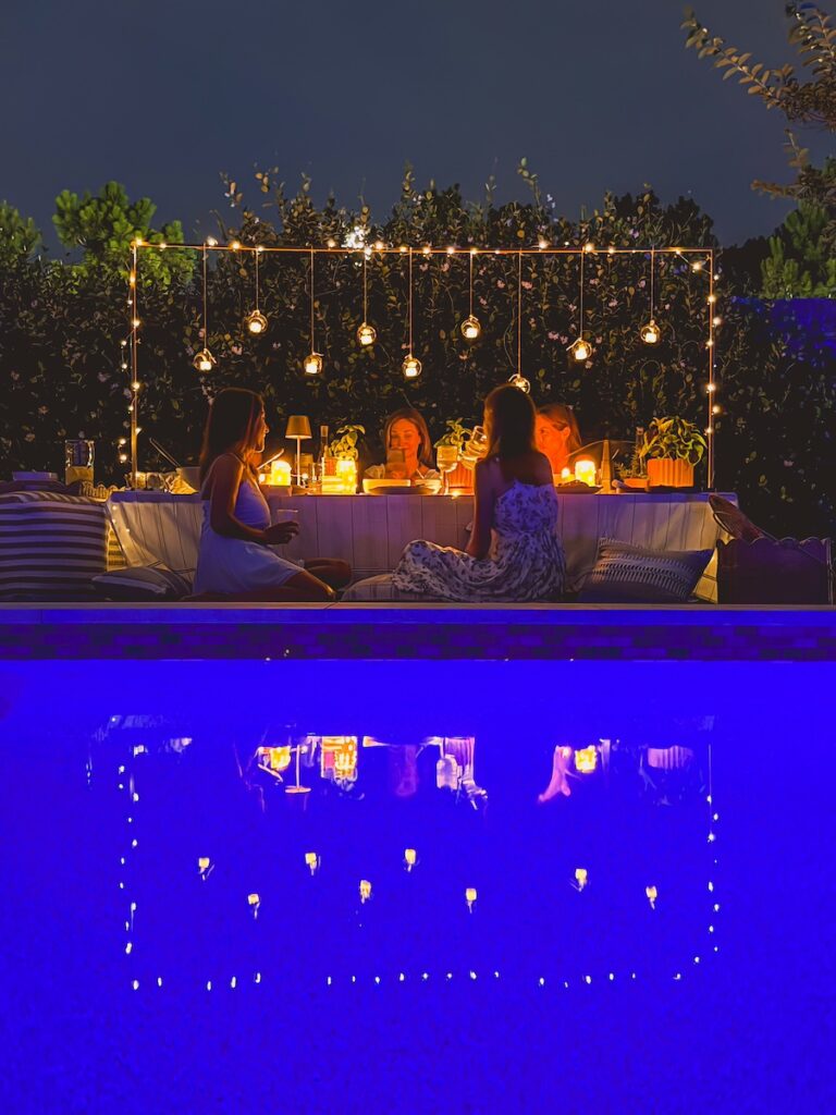 hanging lantern overtop table at night with warm glow