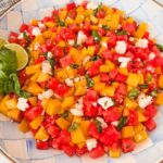 watermelon peach feta salad in a serving bowl for summer