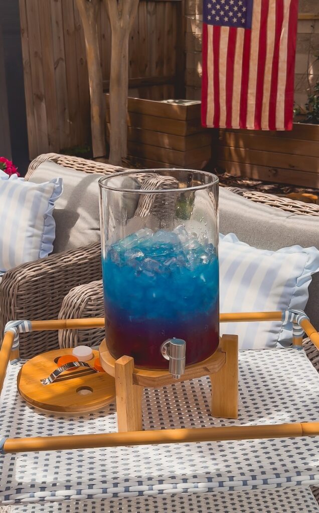 blue gatorade layered on top of the cranberry juice