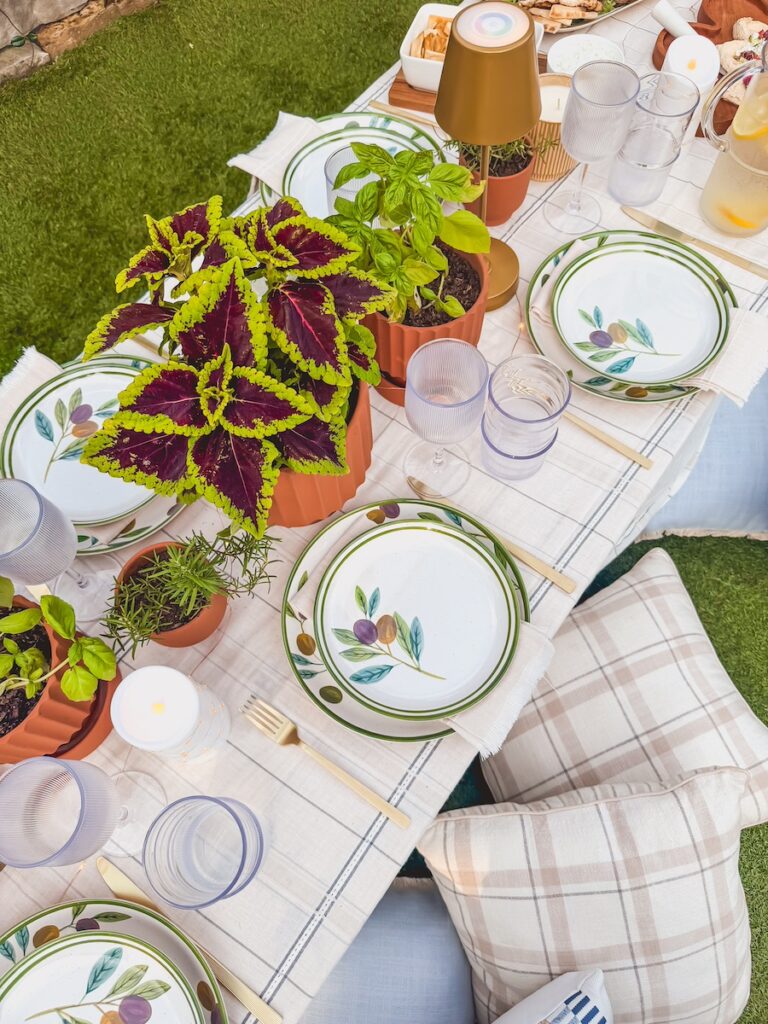 close up of herb centerpiece on backyard table