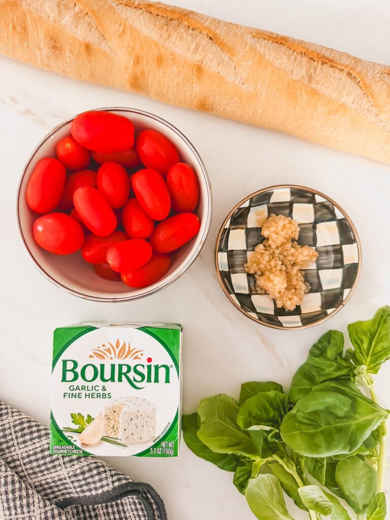 flatlay of ingredients ; boursin, garlic, basil, tomatoes