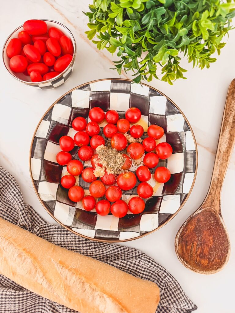 cherry tomatoes in baking dish with seasoning