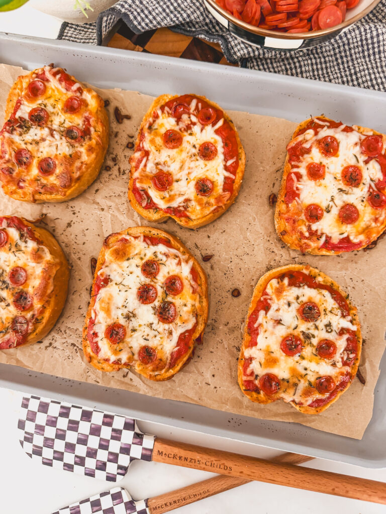overhead view of toasts baked on sheet tray
