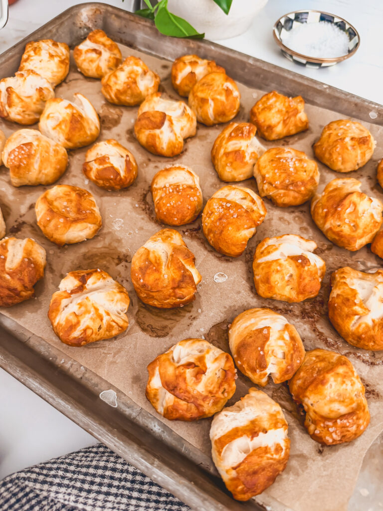 baked biscuit pretzel bites on sheet tray