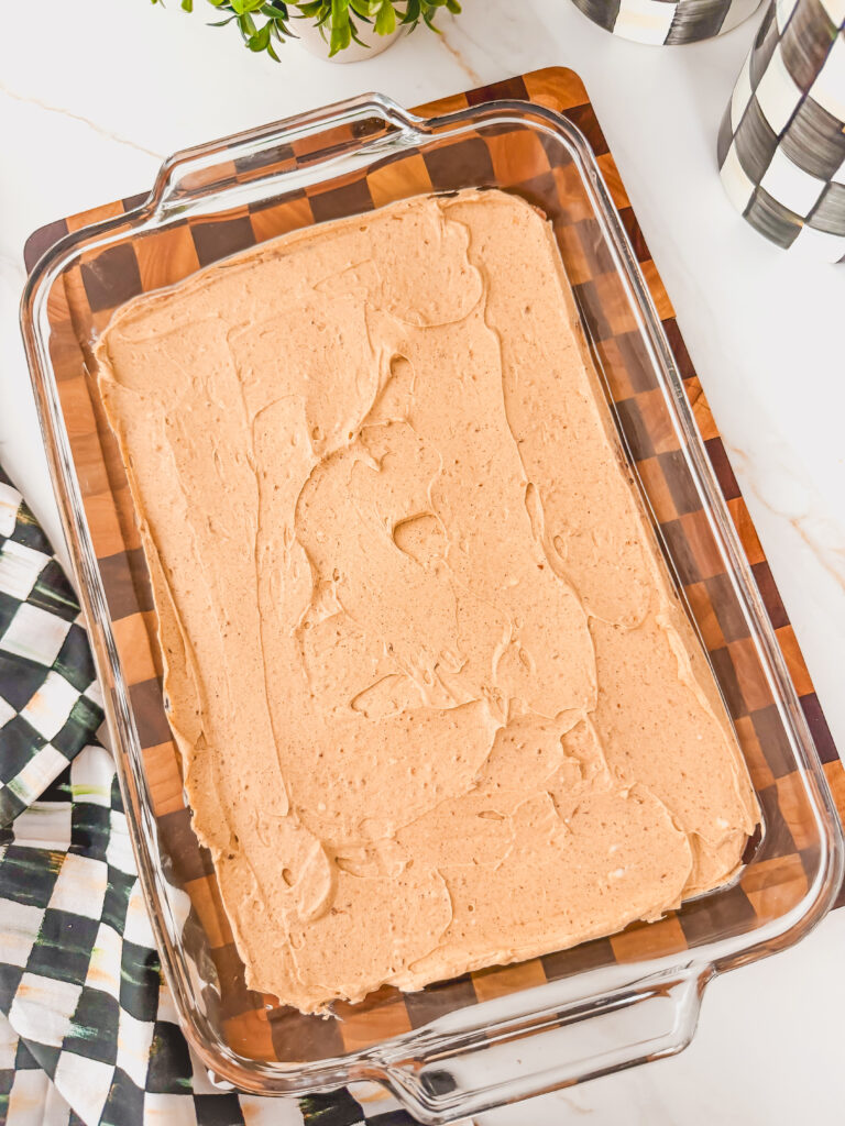 Glass baking dish with refried beans.