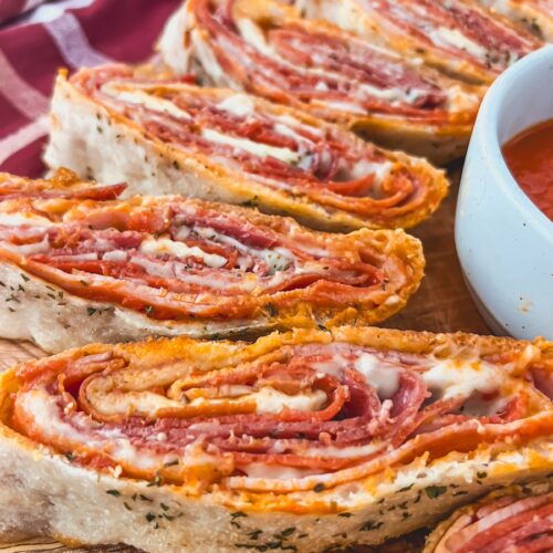 close up of italian stromboli with ham, pepperoni , salami, mozzarella
