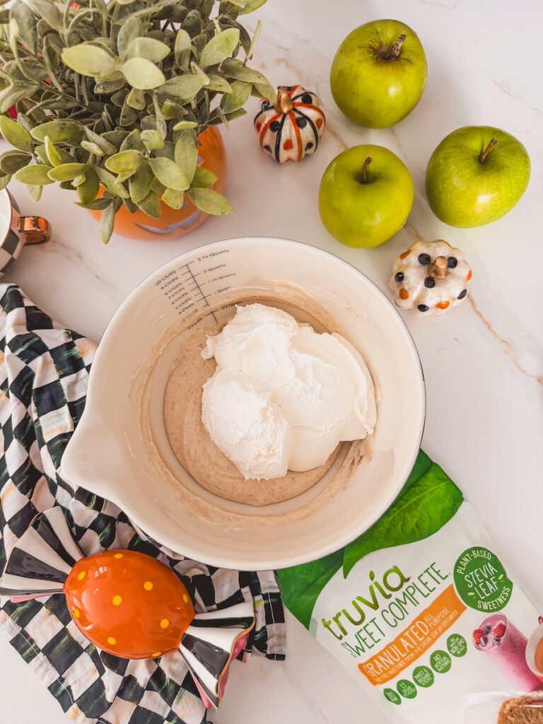 add whipped topping to mixing bowl with cheesecake ingredients