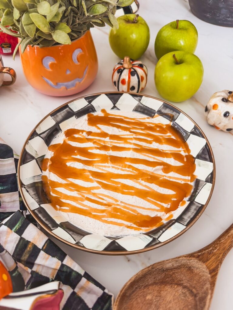 caramel sauce drizzled on top of cheesecake layer