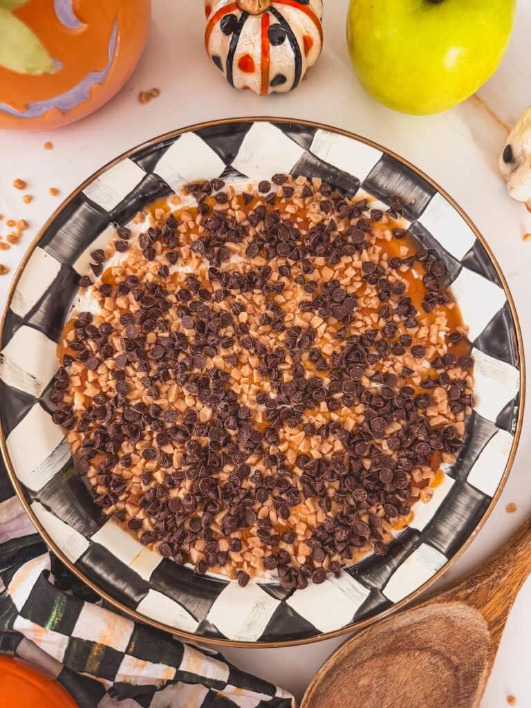 toffee bits and mini chocolate chips on top of caramel sauce 