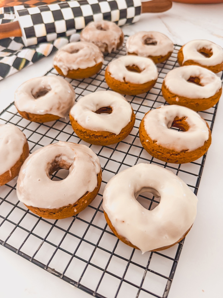 3 ingredient pumpkin spice cookies with cream cheese frosting on drying rack