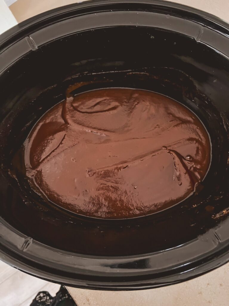 pumpkin apple butter in base of slow cooker