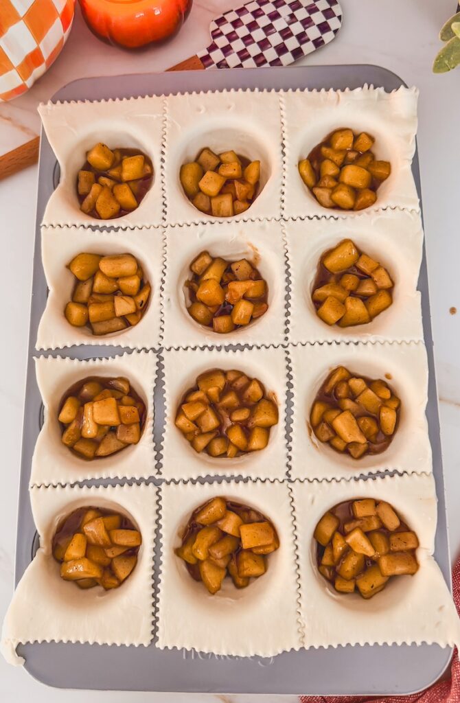 puff pastry cut into squares around muffin
