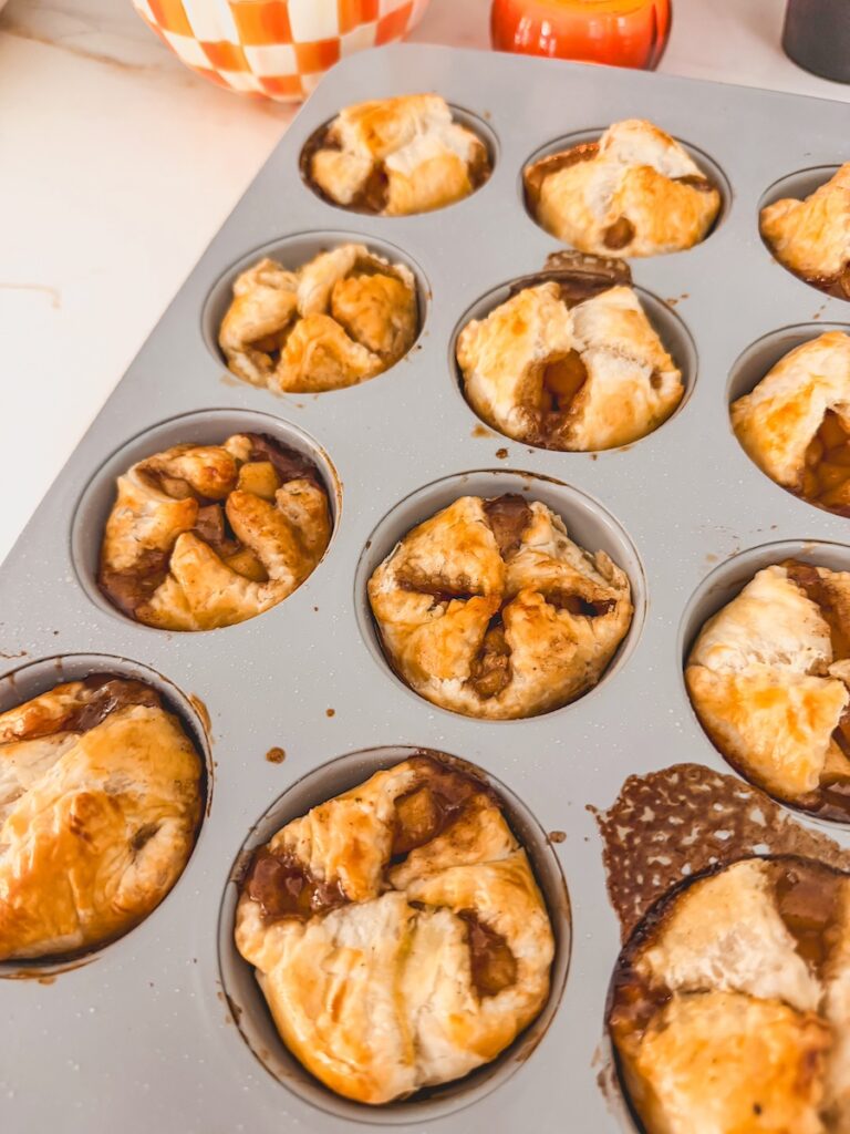 apple pastries cooked. in muffin tin