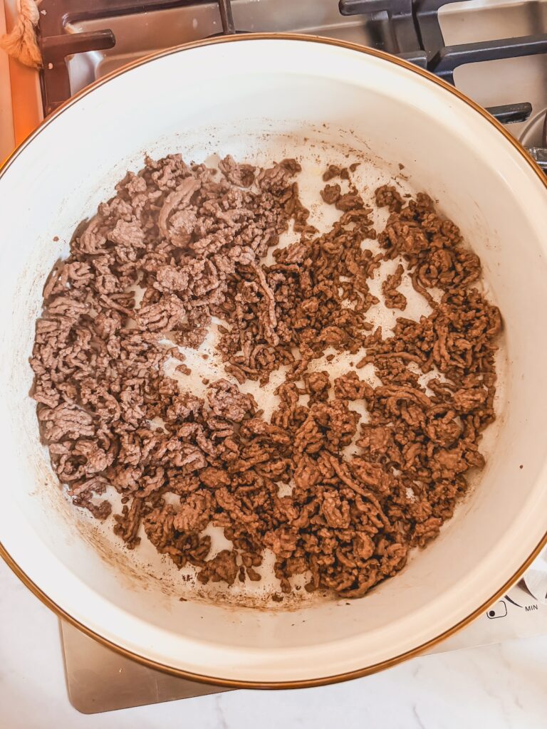 cooked ground beef in skillet