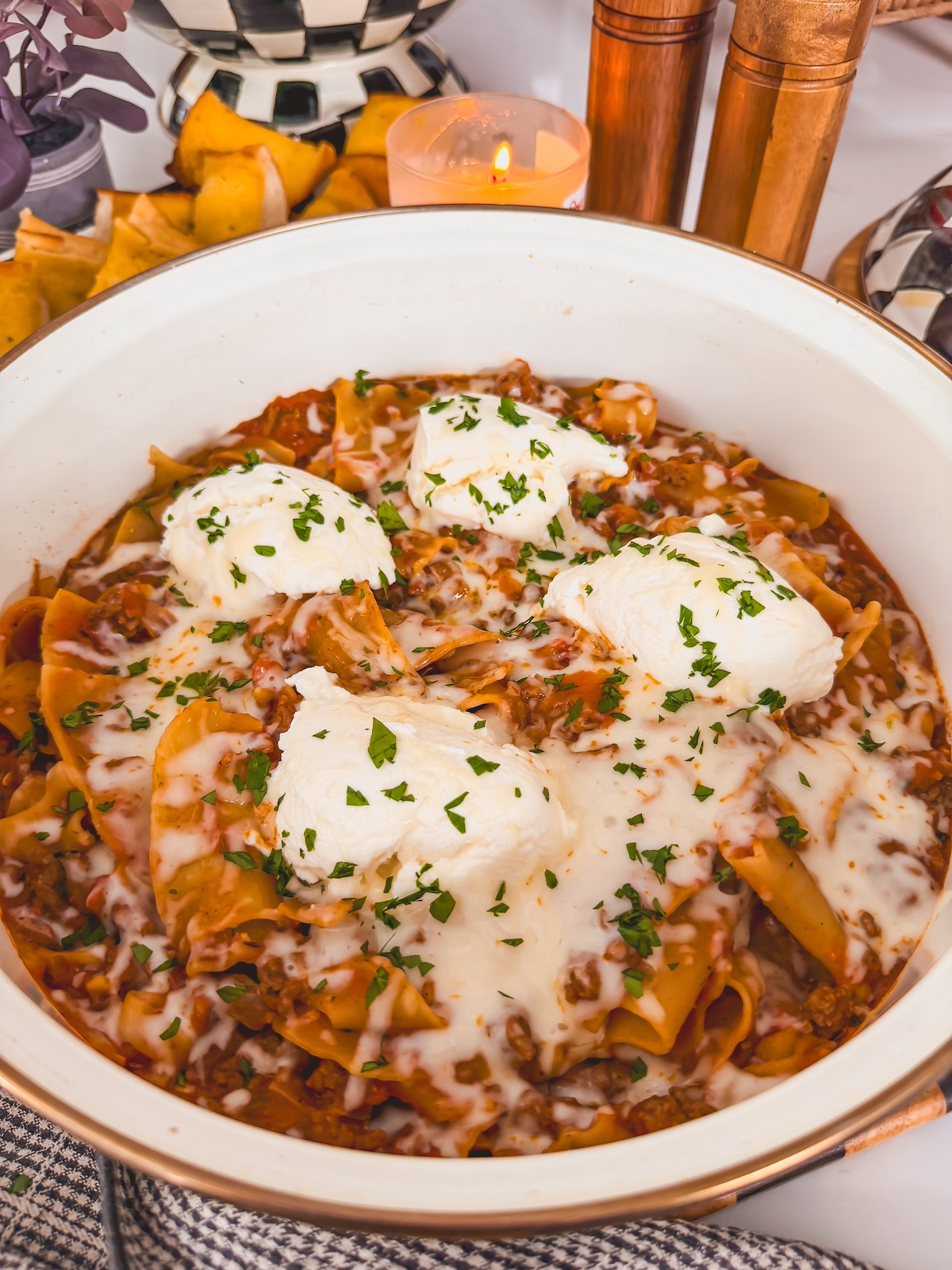 lazy one pan skillet lasagna in white deep skillet with ricotta cheese 
