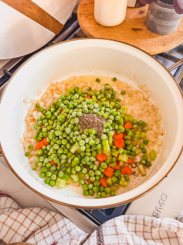 add peas, carrots, celery and thyme to skillet