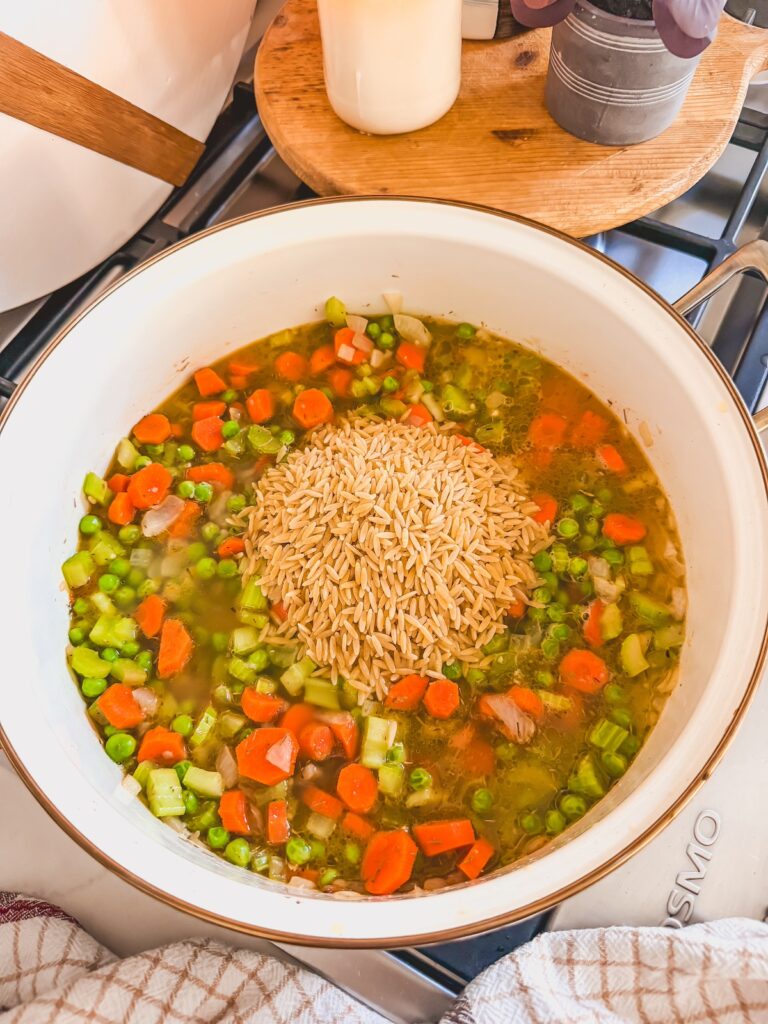 add orzo and chicken broth