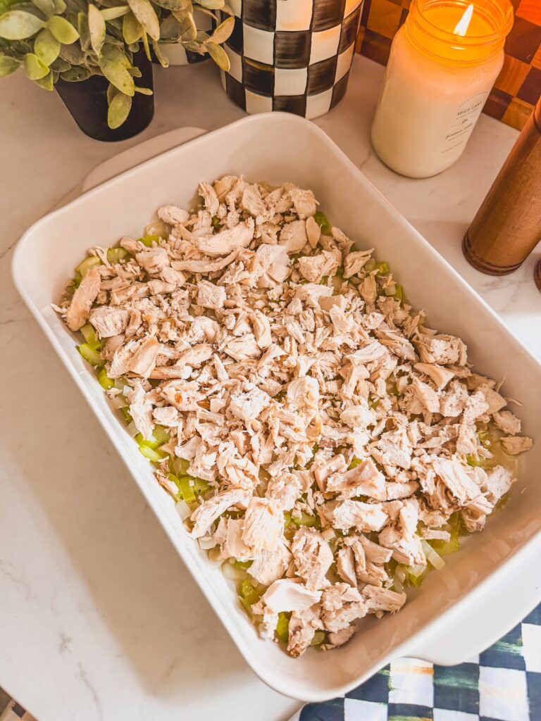 chicken layered into baking dish