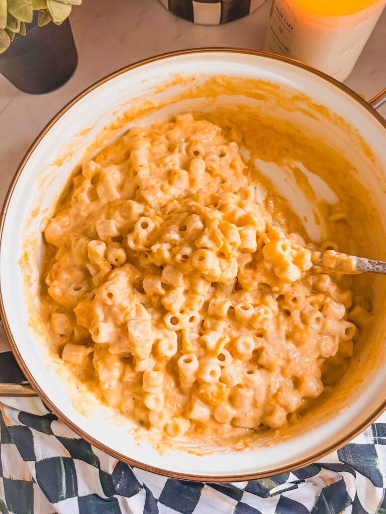 mac and cheese in pot with spoon