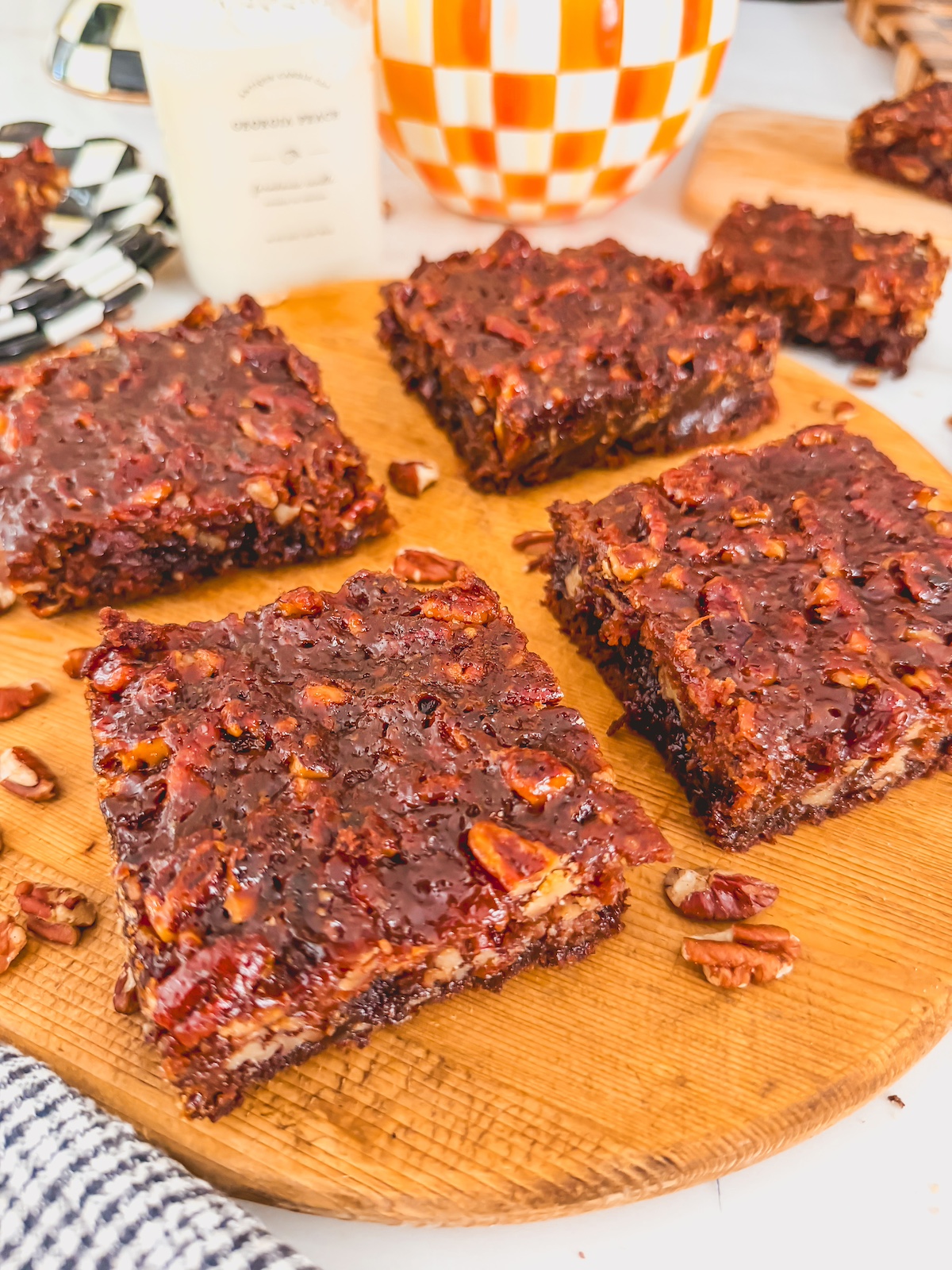 4 brownies on a wooden board