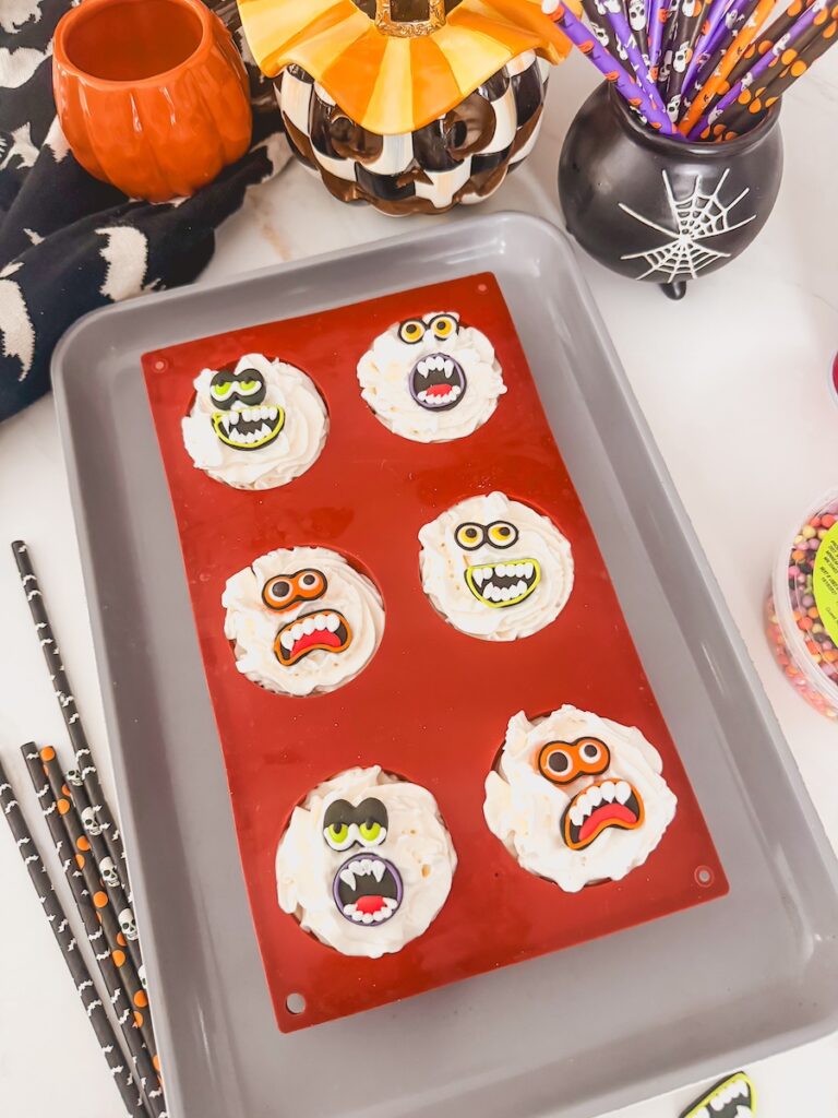 monster face candy decorations on whipped cream
