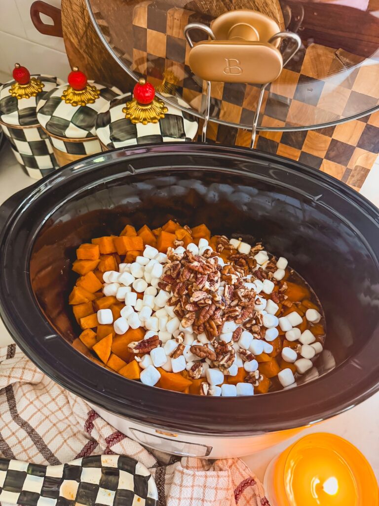 nuts and casserole ingredients in bottom of slow cooker