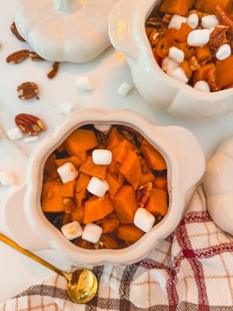 sweet potato casserole portioned into small white pumpkin dishes