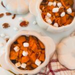 sweet potato casserole in two small white pumpkin dishes