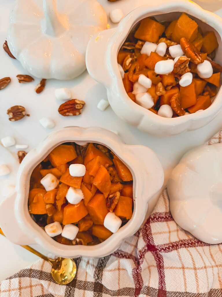 sweet potato casserole in two small white pumpkin dishes