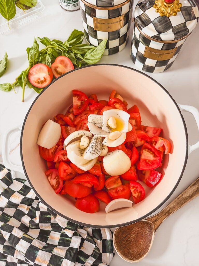 tomatoes, garlic and onion in dutch oven 
