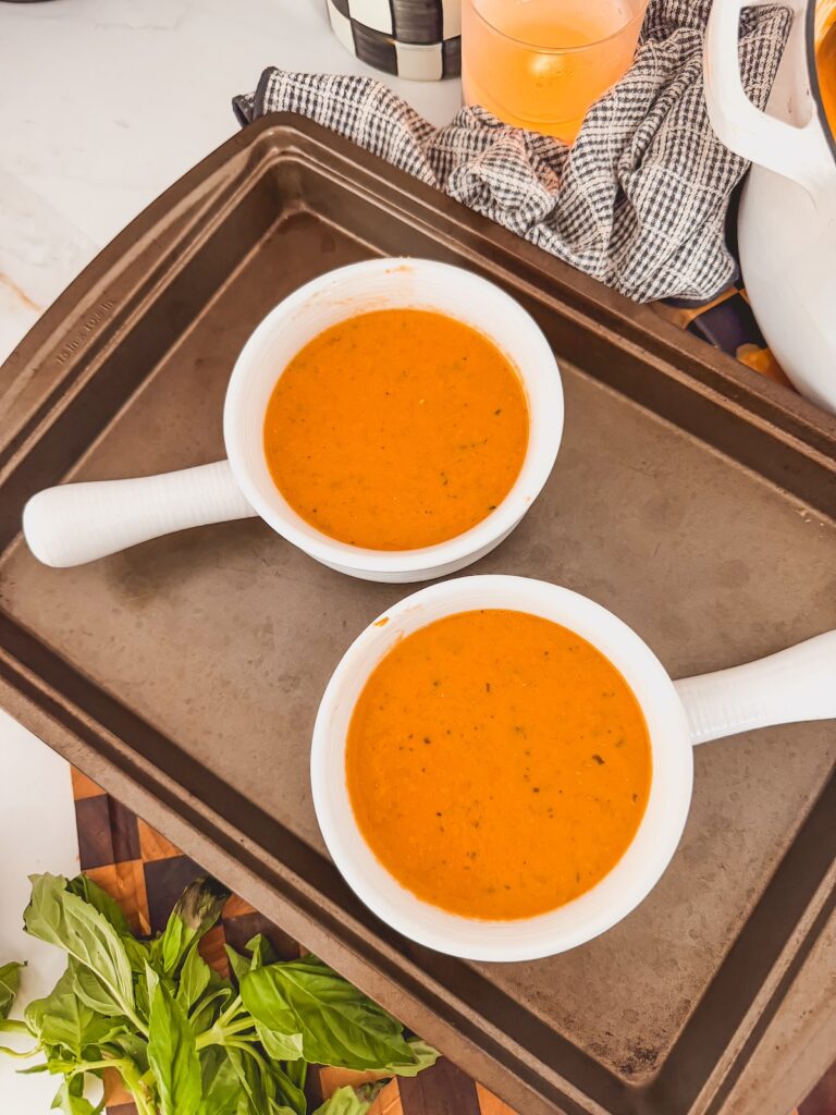 soup poured into mini crocs on top of baking sheet