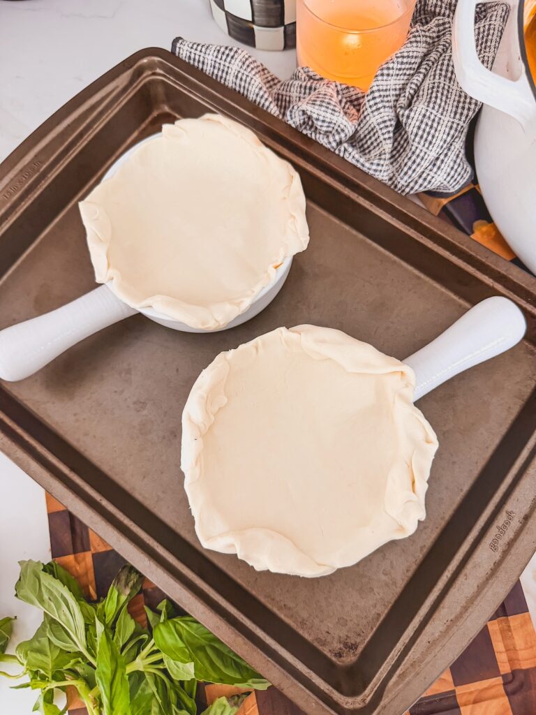 puff pastry laid on top of croc and sealed along the edges on baking sheet