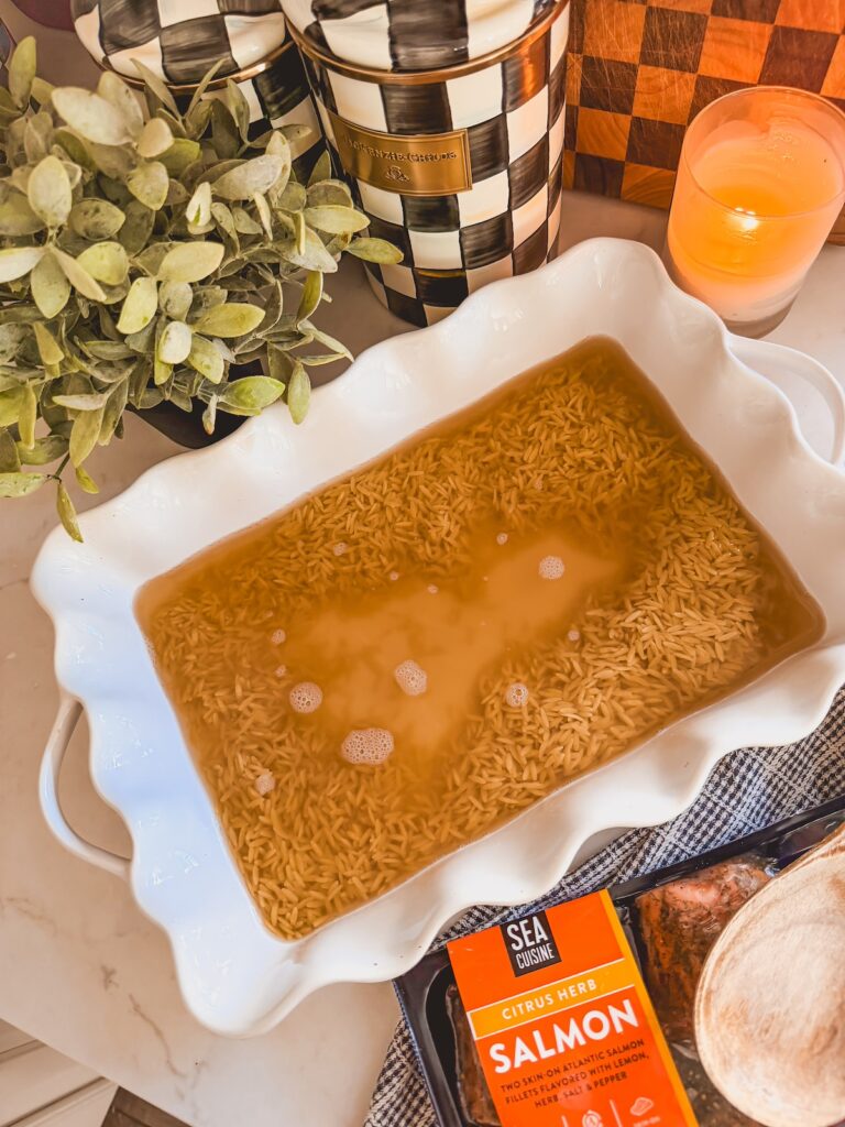 orzo and broth in baking dish