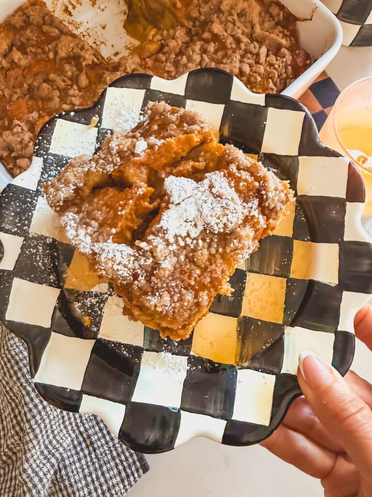 pumpkin french toast bake with syrup and powdered sugar