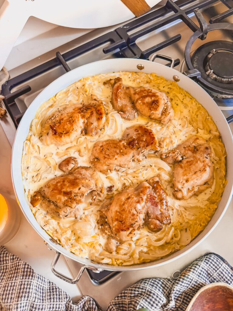 orzo added to skillet with chicken