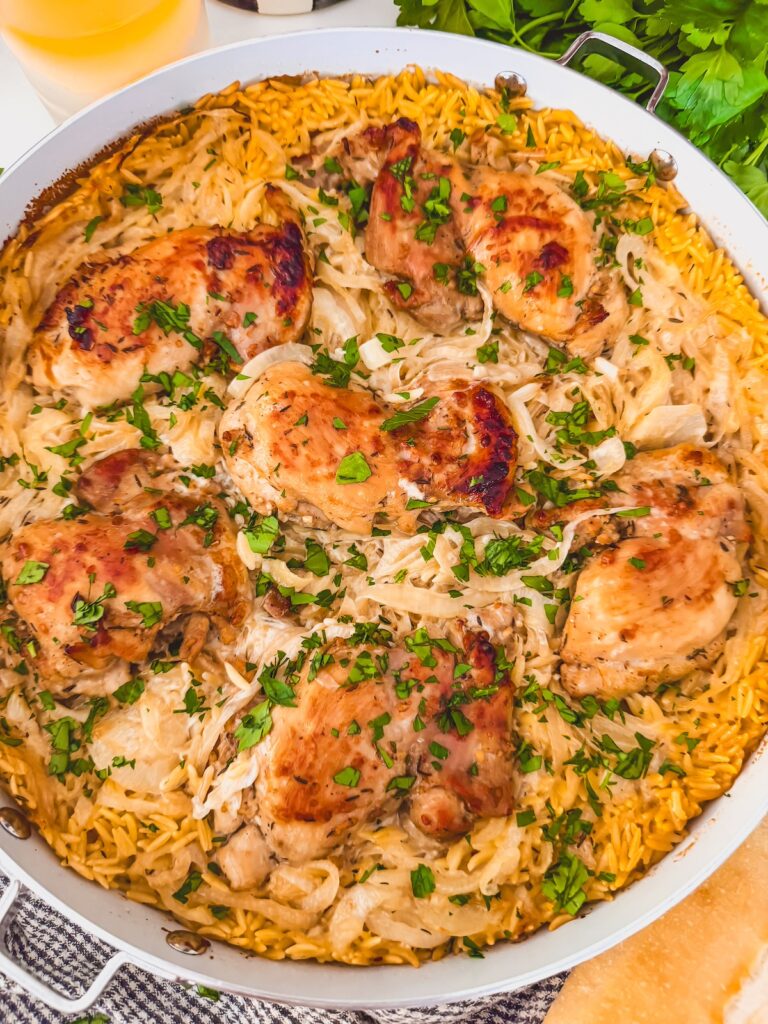 close up of french onion chicken and orzo skillet