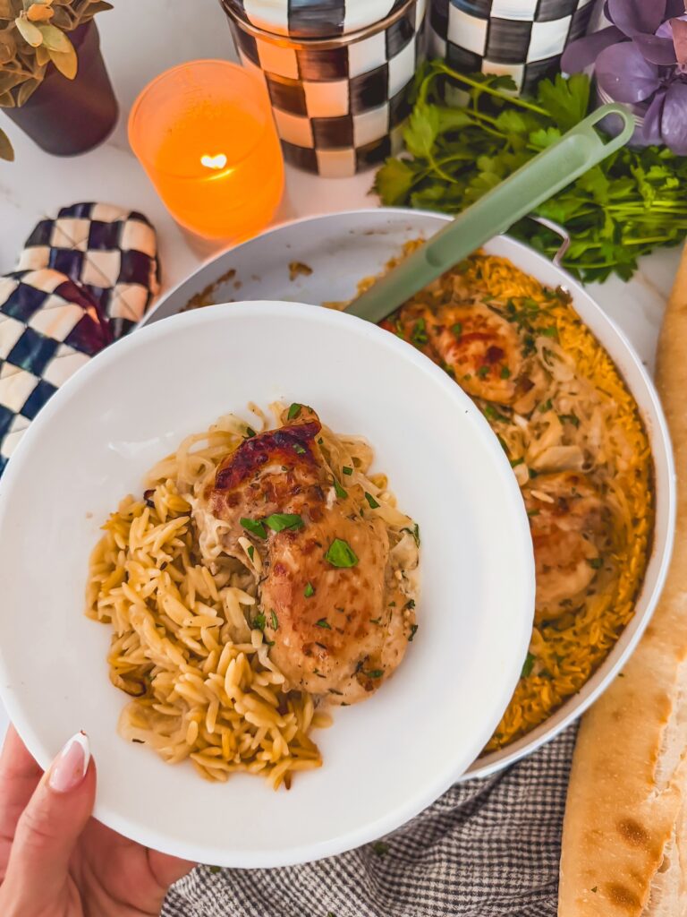 french onion chicken and orzo served on a white plate