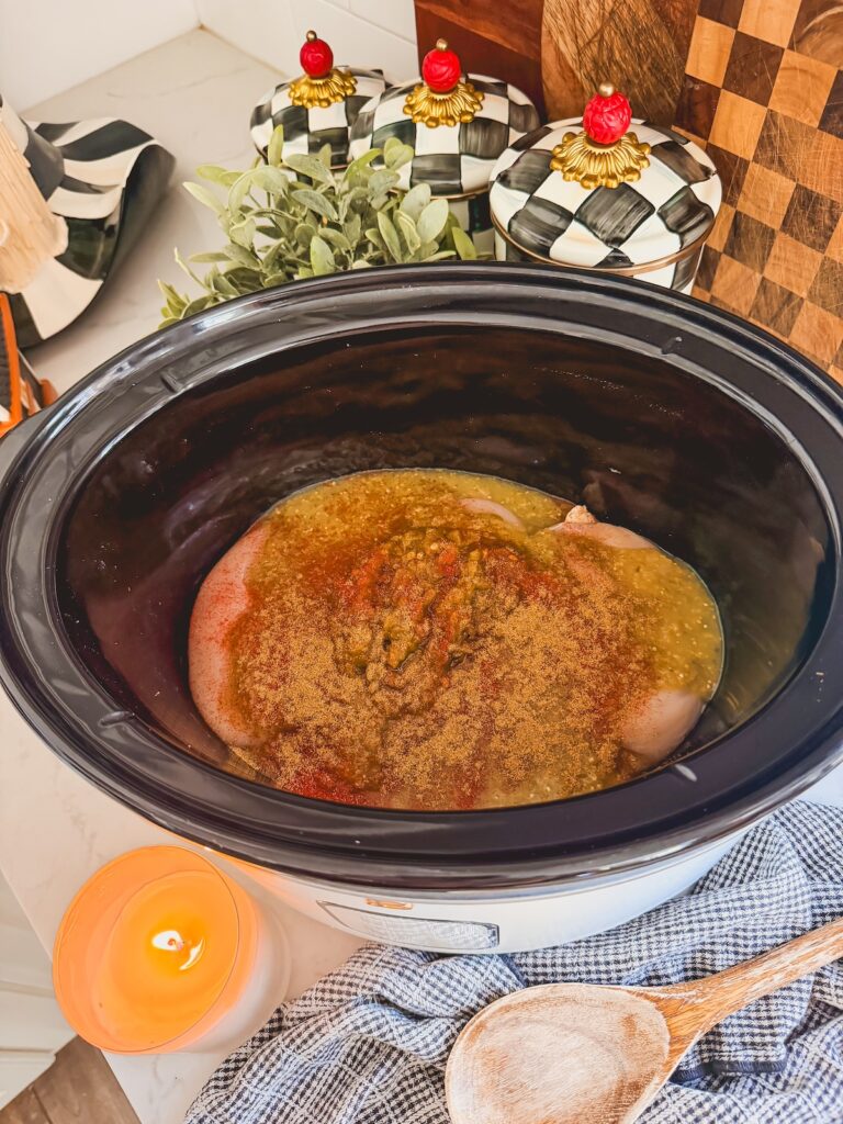 salsa verde chicken and green chilies on top of chicken