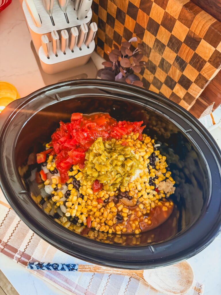 chicken, beans, corn, spices in slow cooker