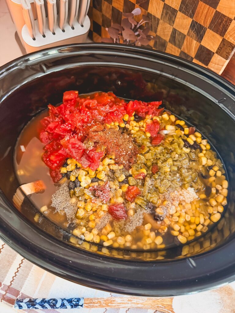 chicken broth added to chicken tortilla soup in slow cooker