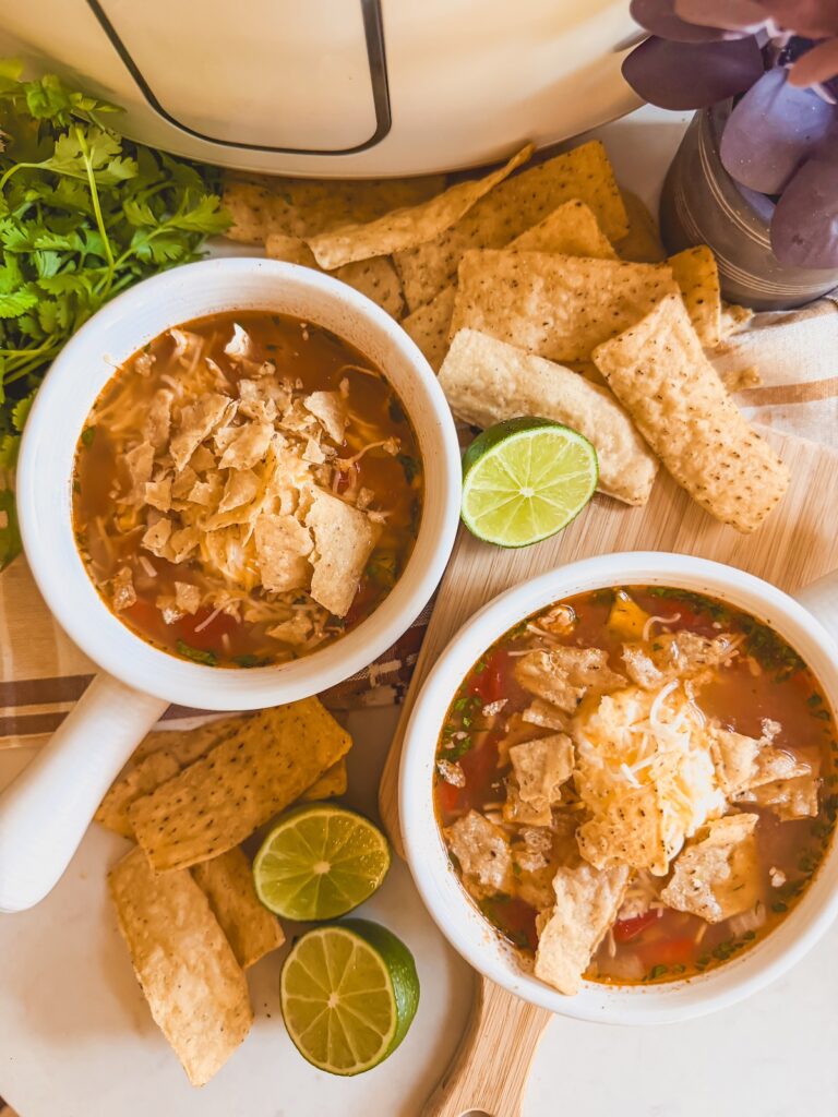 close up of chicken tortilla soup in bowls