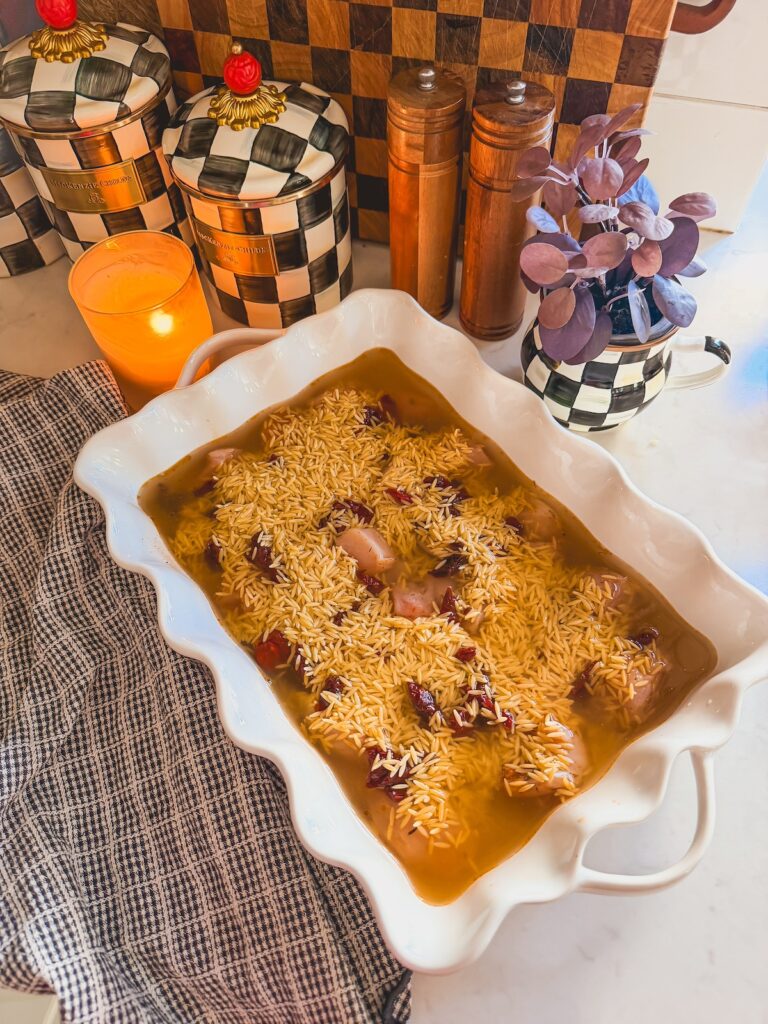 orzo and chicken broth in baking dish
