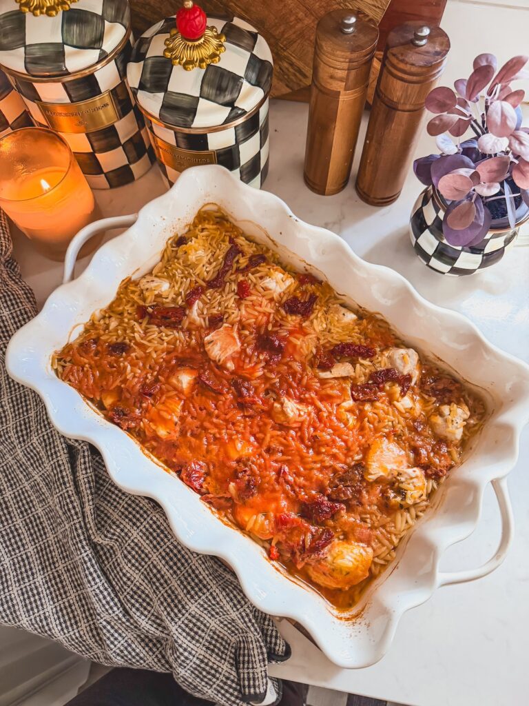 chicken, orzo and broth in baking dish